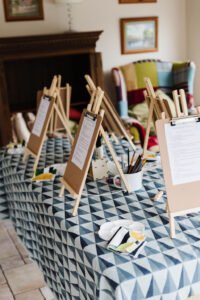Art easels arranged on a brightly decorated craft table
