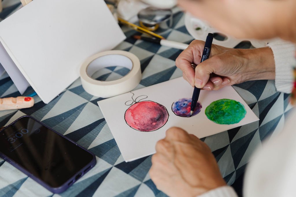 Woman practising drawing and painting techniques in a workshop